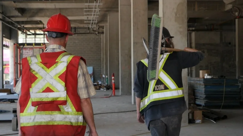 Project personnel walking through an active industrial work site